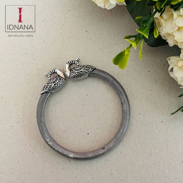 SILVER TONE PEACOCK FACE BANGLE (TWIST AND OPEN) SIZE 2.4