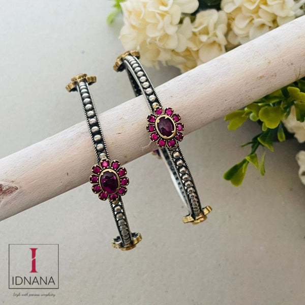 A PAIR OF DUAL TONE PINK KEMP FLORAL BANGLES