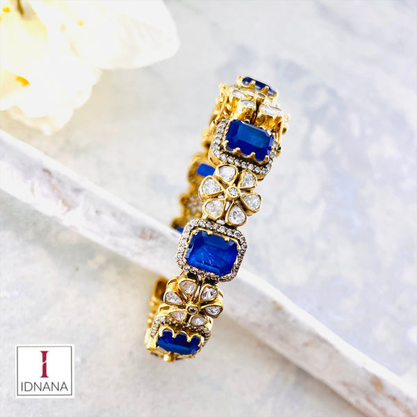 GOLD PLATED BLUE DOUBLET MOISSANITE FLORAL BANGLE (2.4 OPENABLE)