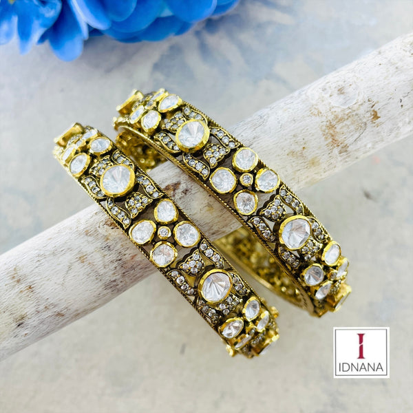 A PAIR OF GOLD PLATED FLORAL MOISSANITE CUBIC ZIRCONIA  BANGLE 2.4 SIZE OPENABLE