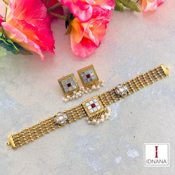 GOLD PLATED MOTHER OF PEARL RED KUNDAN FLORAL WHITE KUNDAN CHOKER SET